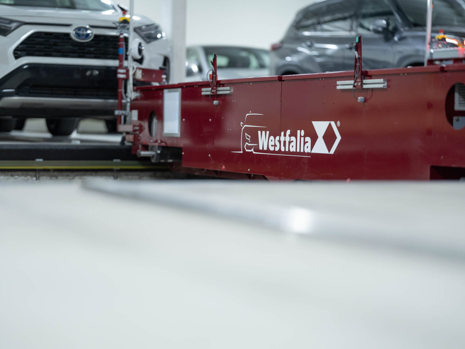 Automated Parking Systems Satellite with cars in the background